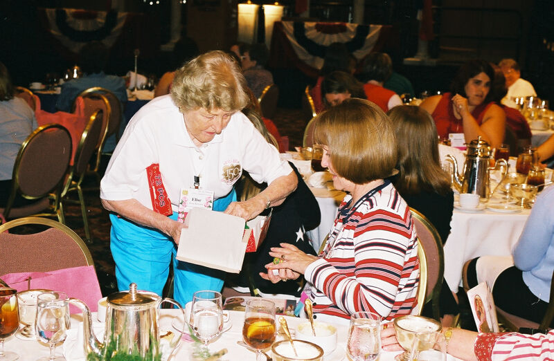 Elise Rawson Handing Out Favors at Convention Photograph, July 4-8, 2002 (Image)