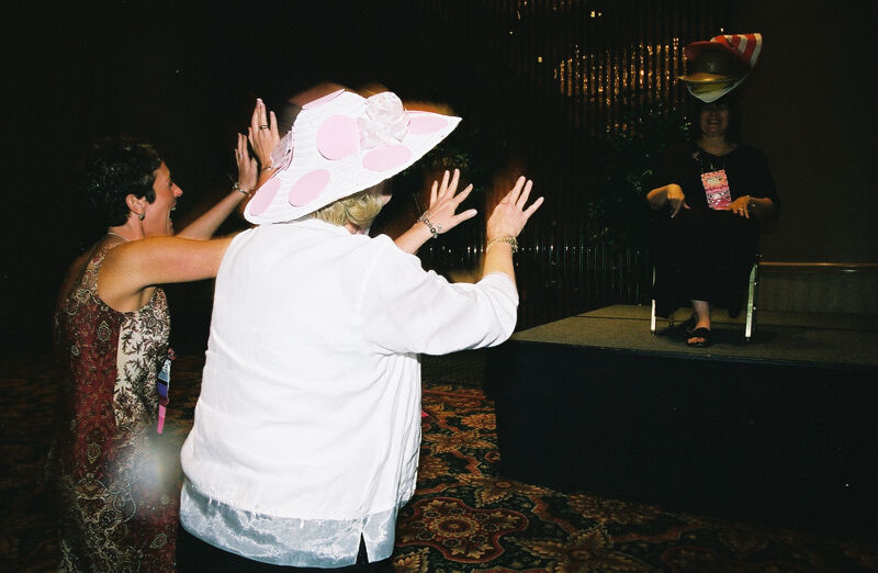 Wooley and Moore Waving at Johnson at Convention Officers' Luncheon Photograph 1, July 4-8, 2002 (Image)