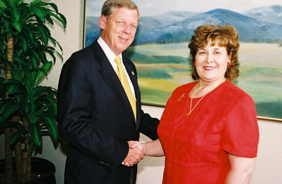 Johnny Isakson and Mary Jane Johnson Shaking Hands at Convention Photograph 5, July 4-8, 2002 (image)