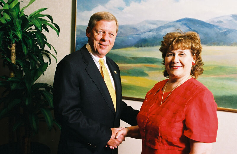 Johnny Isakson and Mary Jane Johnson Shaking Hands at Convention Photograph 7, July 4-8, 2002 (Image)