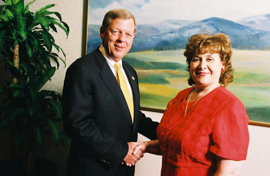 Johnny Isakson and Mary Jane Johnson Shaking Hands at Convention Photograph 6, July 4-8, 2002 (image)