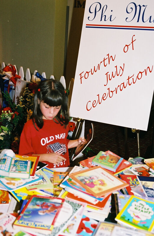 Young Girl With Books at Convention Photograph 2, July 4-8, 2002 (Image)