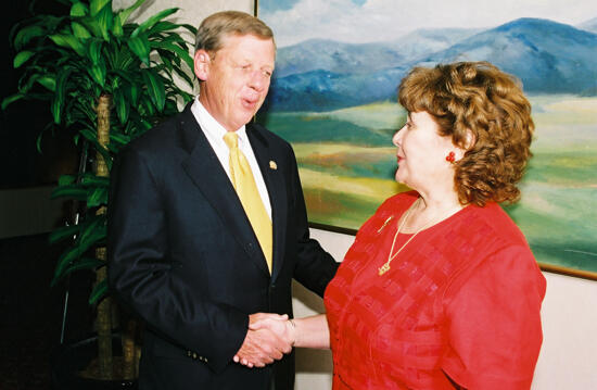 Johnny Isakson and Mary Jane Johnson Shaking Hands at Convention Photograph 2, July 4-8, 2002 (image)