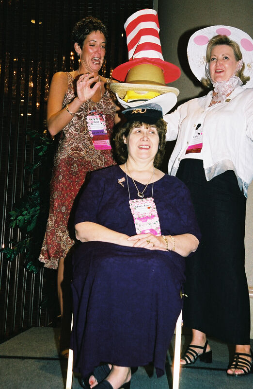 Wooley and Moore Placing Hat on Johnson at Convention Officers' Luncheon Photograph 2, July 4-8, 2002 (Image)