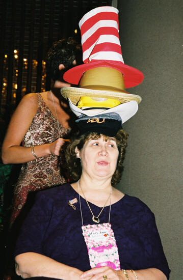 Mary Jane Johnson Wearing Multiple Hats at Convention Officers' Luncheon Photograph 5, July 4-8, 2002 (image)