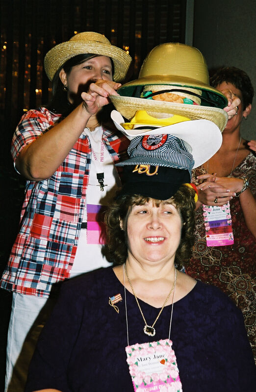 Mary Jane Johnson Wearing Multiple Hats at Convention Officers' Luncheon Photograph 3, July 4-8, 2002 (Image)