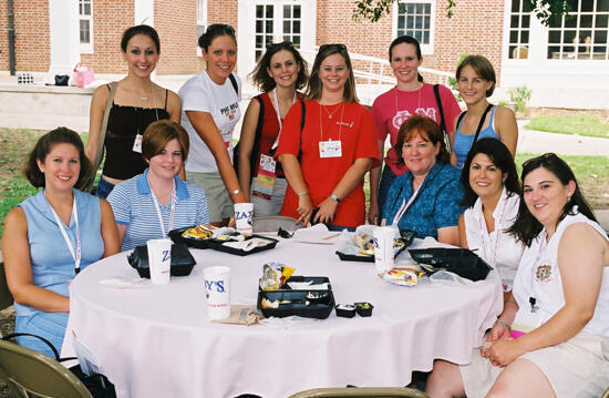 Table of 11 Outside at Wesleyan College During Convention Photograph 2, July 4-8, 2002 (image)