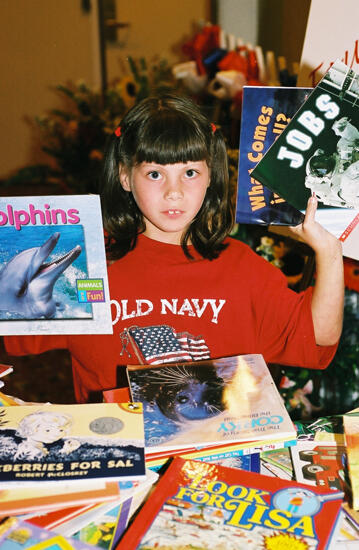 Young Girl With Books at Convention Photograph 4, July 4-8, 2002 (image)