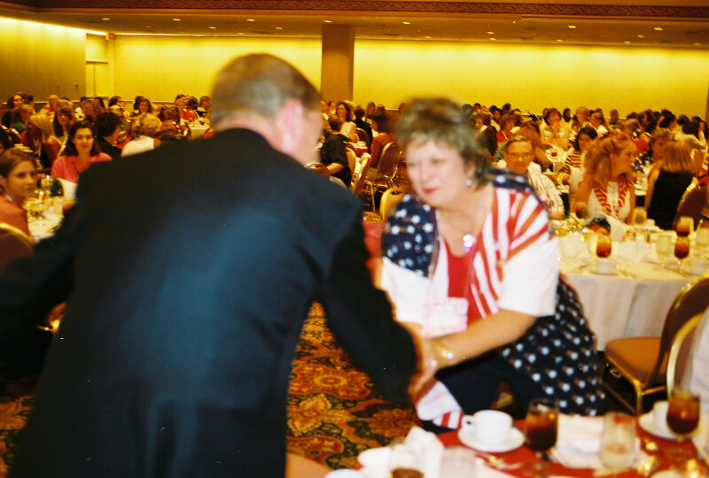 Johnny Isakson Greeting Kathy Williams at Convention Welcome Dinner Photograph, July 4, 2002 (Image)