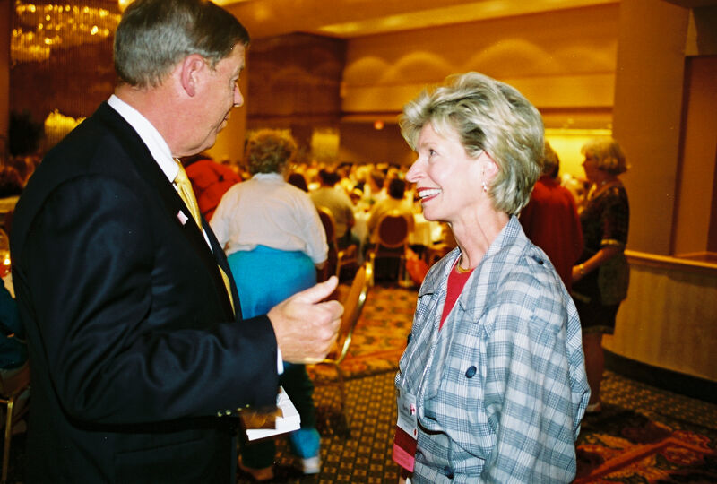 Johnny Isakson Talking to Unidentified at Convention Welcome Dinner Photograph 2, July 4, 2002 (Image)