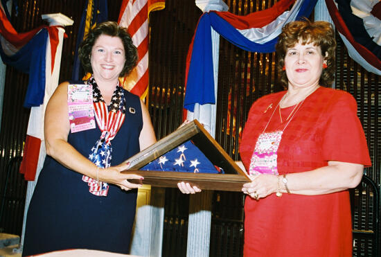 Frances Mitchelson and Mary Jane Johnson With American Flag at Convention Welcome Dinner Photograph 2, July 4, 2002 (image)