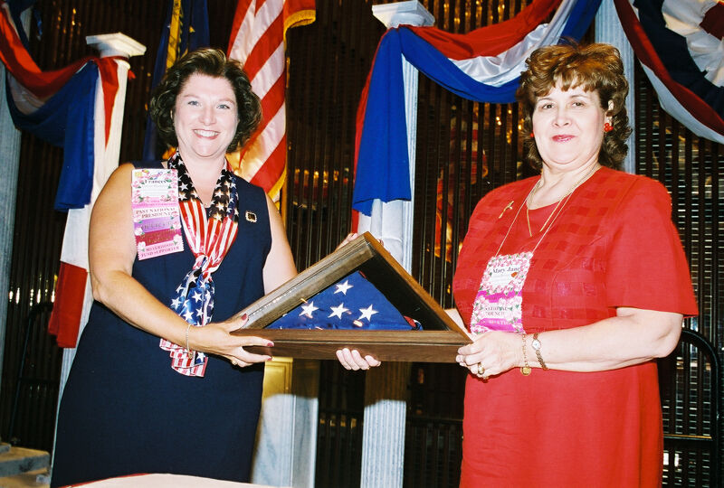 Frances Mitchelson and Mary Jane Johnson With American Flag at Convention Welcome Dinner Photograph 3, July 4, 2002 (Image)