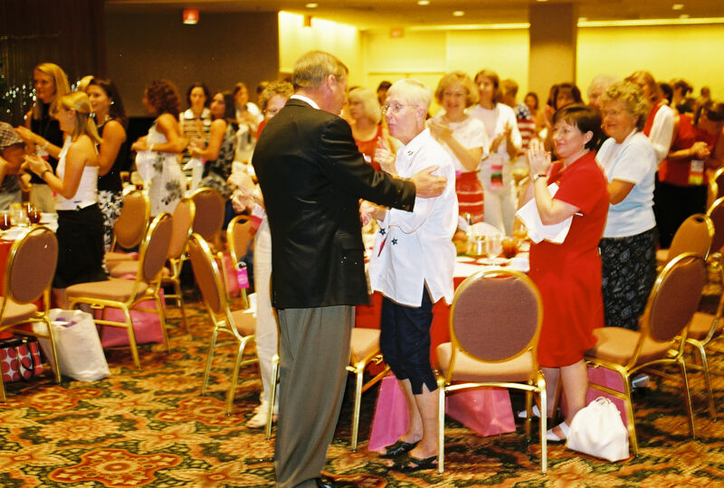 Johnny Isakson Greeting Phi Mus at Convention Welcome Dinner Photograph, July 4, 2002 (Image)