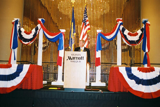 Johnny Isakson Speaking at Convention Welcome Dinner Photograph 12, July 4, 2002 (image)