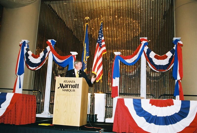 Johnny Isakson Speaking at Convention Welcome Dinner Photograph 1, July 4, 2002 (Image)