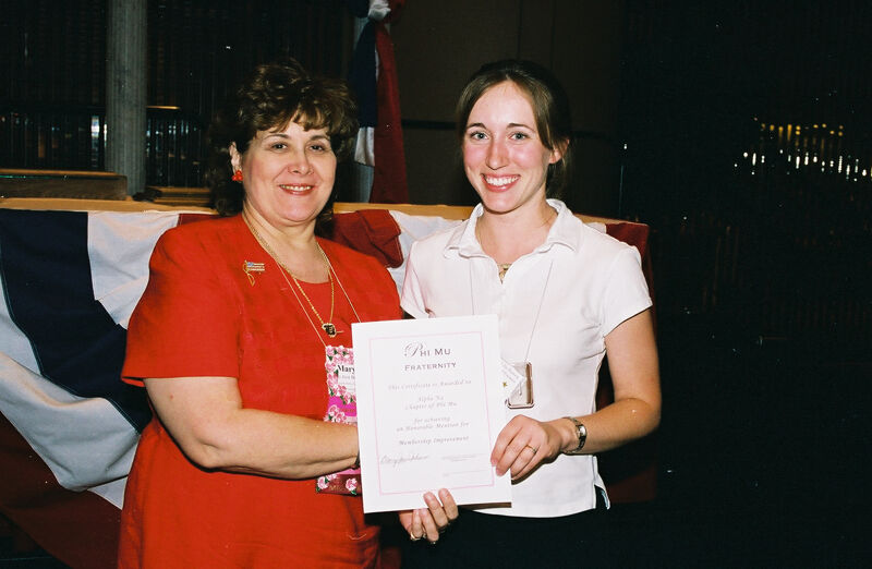 Mary Jane Johnson and Alpha Nu Chapter Member With Certificate at Convention Photograph 4, July 4-8, 2002 (Image)