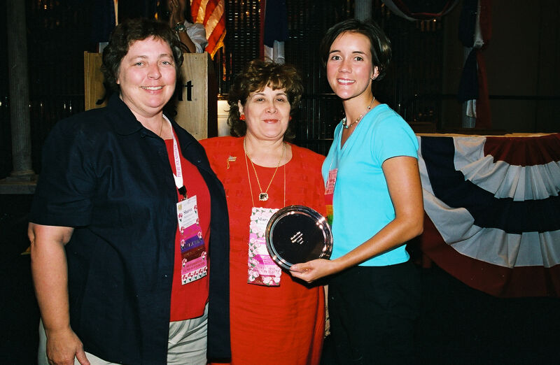 Sharon, Johnson, and Shannon With Award at Convention Photograph, July 4-8, 2002 (Image)