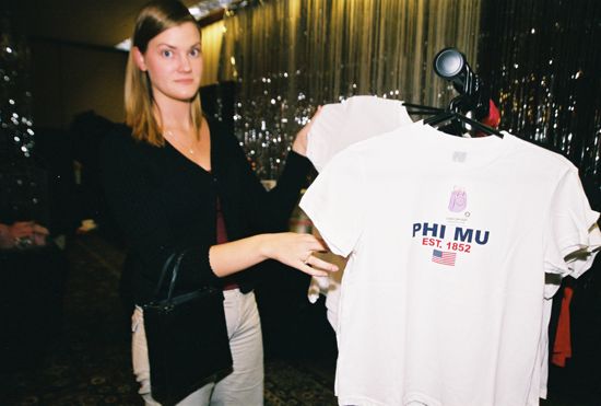 Phi Mu Looking at Shirts in Convention Carnation Shop Photograph 1, July 4-8, 2002 (image)