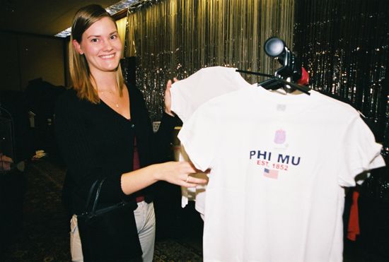 Phi Mu Looking at Shirts in Convention Carnation Shop Photograph 2, July 4-8, 2002 (image)