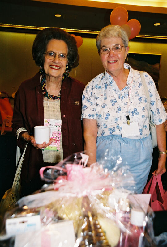 Joan Wallem and Unidentified With Gift Basket at Convention Photograph, July 4-8, 2002 (Image)