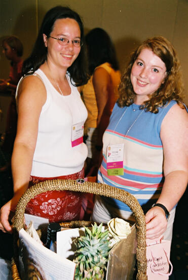 Alysia and Unidentified With Basket at Convention Photograph 1, July 4-8, 2002 (image)