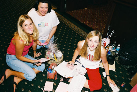 Three Phi Mus Writing Notes at Convention Photograph, July 4-8, 2002 (image)