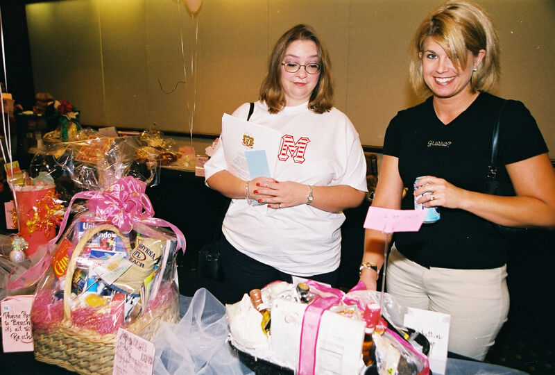 Two Phi Mus With Gift Baskets at Convention Photograph, July 4-8, 2002 (Image)