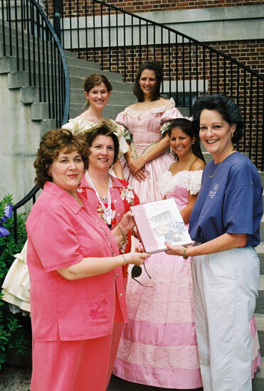 Johnson, Mitchelson, and Others With History Book at Convention Photograph 2, July 4-8, 2002 (image)