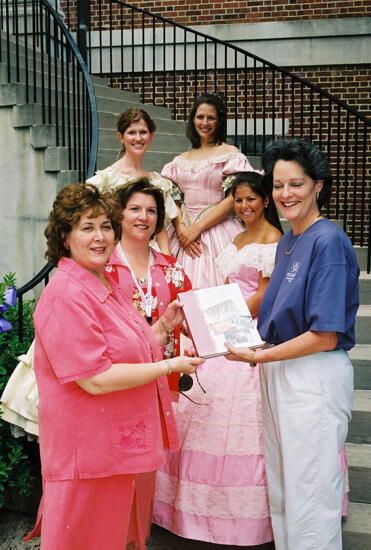 Johnson, Mitchelson, and Others With History Book at Convention Photograph 1, July 4-8, 2002 (image)