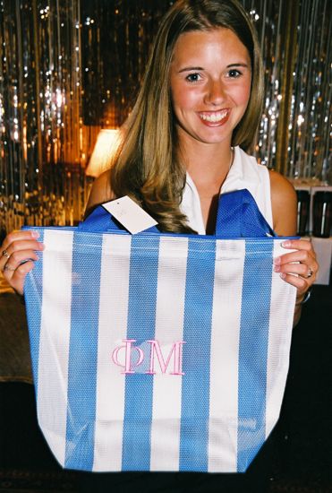 Phi Mu Holding Bag in Convention Carnation Shop Photograph, July 4-8, 2002 (image)