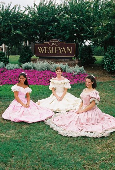 Three Phi Mus in Period Dress by Wesleyan Sign at Convention Photograph 6, July 4-8, 2002 (image)