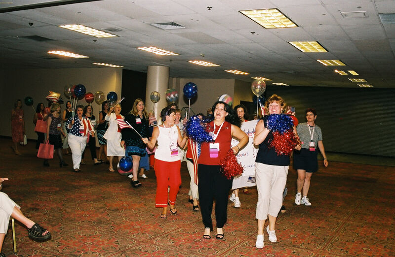 Molly Sorenson Leading Area I Alumnae in Convention Patriotic Parade Photograph, July 4, 2002 (Image)