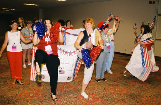 Molly Sorenson and Unidentified Phi Mu Cheerleading at Convention Photograph 1, July 4, 2002 (image)