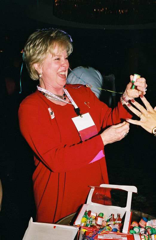 Lana Lewis Sets Off Poppers at Convention Photograph, July 4, 2002 (Image)