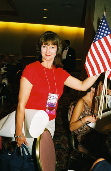 Lana Bulger Carrying Flags at Convention Photograph, July 4-8, 2002 (image)