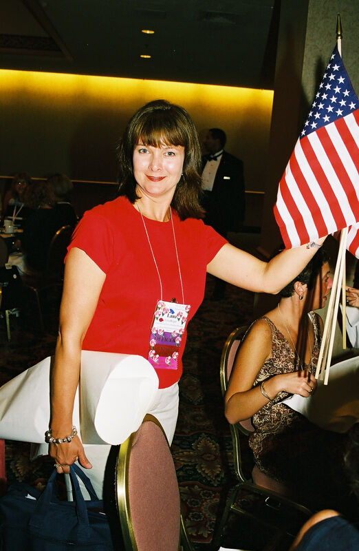 Lana Bulger Carrying Flags at Convention Photograph, July 4-8, 2002 (Image)