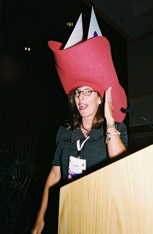 Gayle Price Wearing Large Hat at Convention Officers' Luncheon Photograph 1, July 4-8, 2002 (Image)