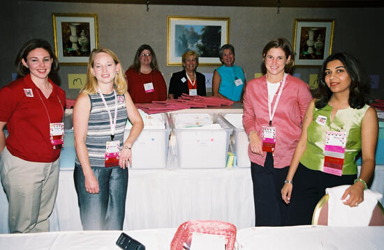 Group of Seven by Convention Registration Table Photograph 1, July 4-8, 2002 (image)