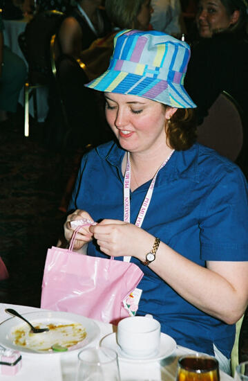 Unidentified Phi Mu in Blue Hat at Convention Officers' Luncheon Photograph, July 4-8, 2002 (image)