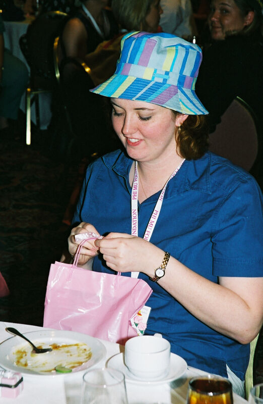 Unidentified Phi Mu in Blue Hat at Convention Officers' Luncheon Photograph, July 4-8, 2002 (Image)