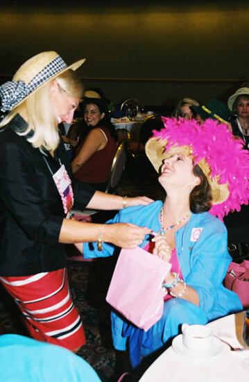 Kris Bridges Presenting Gift to Susan Kendricks at Convention Officers' Luncheon Photograph, July 4-8, 2002 (image)