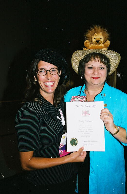 Gayle Price and Kathy Williams With Certificate at Convention Photograph 2, July 4-8, 2002 (Image)