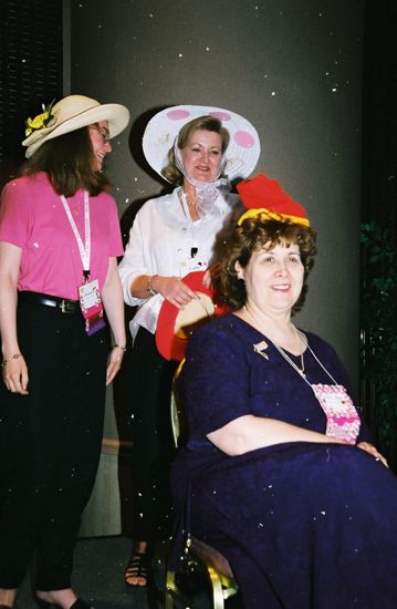 Unidentified and Moore Placing Hat on Johnson at Convention Officers' Luncheon Photograph, July 4-8, 2002 (image)