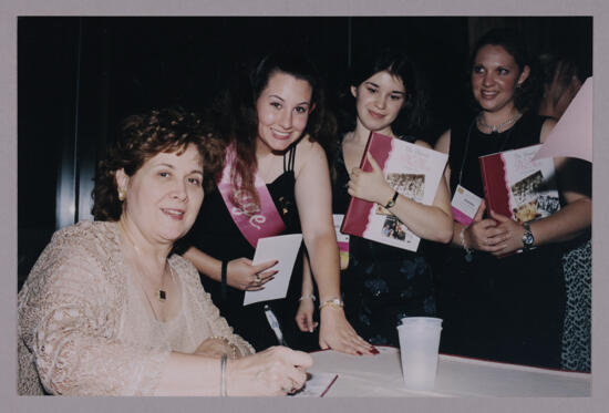 Mary Jane Johnson Signing Autographs at Convention Photograph, July 4-8, 2002 (image)