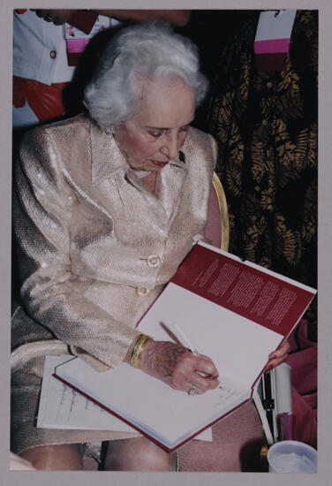 Polly Cowherd Signing Book at Convention Photograph, July 4-8, 2002 (image)