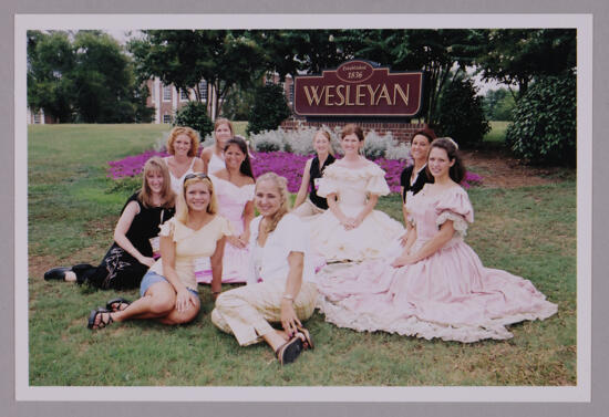 Group of 10 by Wesleyan Sign at Convention Photograph 2, July 4-8, 2002 (image)