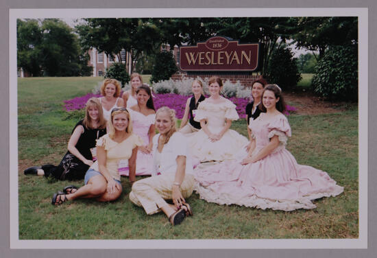 Group of 10 by Wesleyan Sign at Convention Photograph 1, July 4-8, 2002 (image)