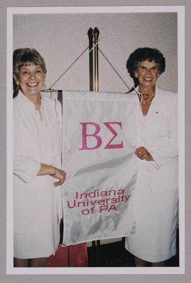 Unidentified and Pat Sackinger With Beta Sigma Chapter Banner at Convention Photograph 1, July 4-8, 2002 (image)