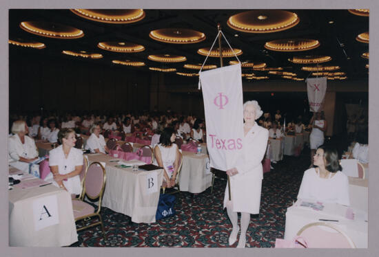 Polly Freear Carrying Phi Chapter Banner at Convention Photograph, July 4-8, 2002 (image)