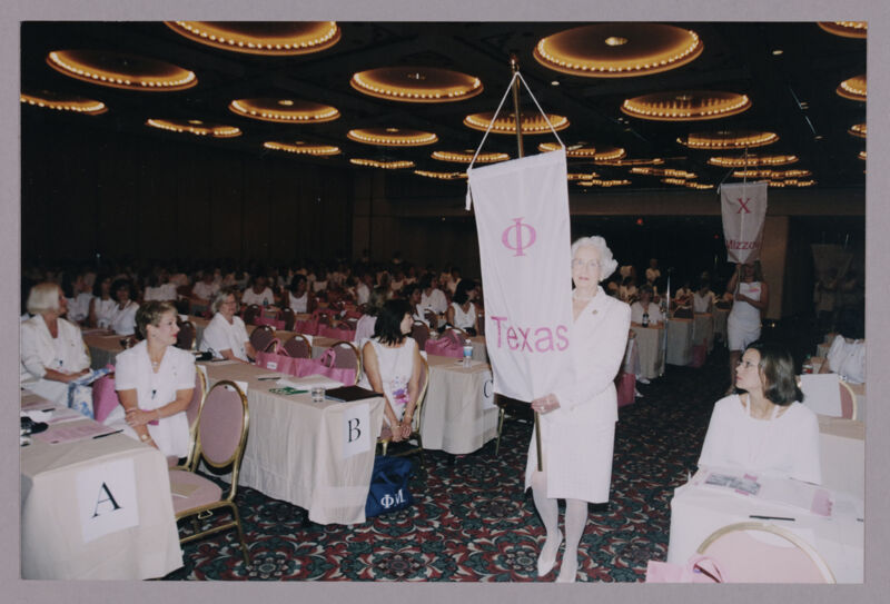 Polly Freear Carrying Phi Chapter Banner at Convention Photograph, July 4-8, 2002 (Image)